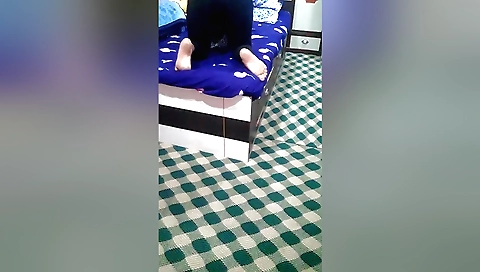 Indian girl masturbates on a bed in a solo porn video