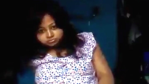 Indian brunette in a pink dress makes herself naked on web cam