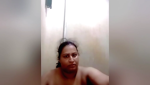 Busty milf fucks herself on the bed after she masturbates