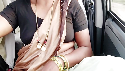 Indian babe in a sexy dress masturbates in the car