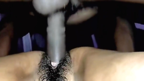 Hairy girl with a nice natural body fucks her man on the bed