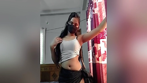 Solo female masturbates in a bedroom in a room in a house