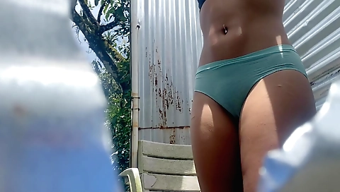 Sexy girl with a long black hair recording outdoors