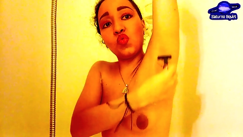 Indian brunette in dress gets naked while taking bath